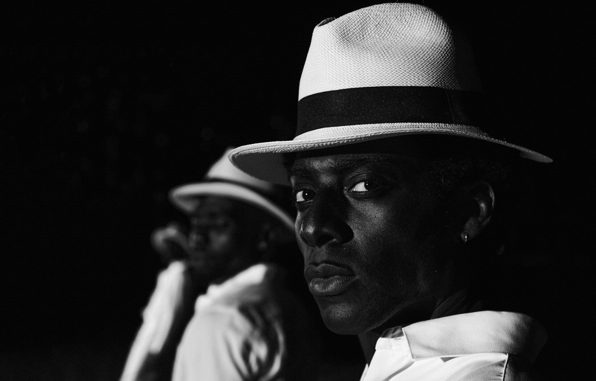 Two men in white hats